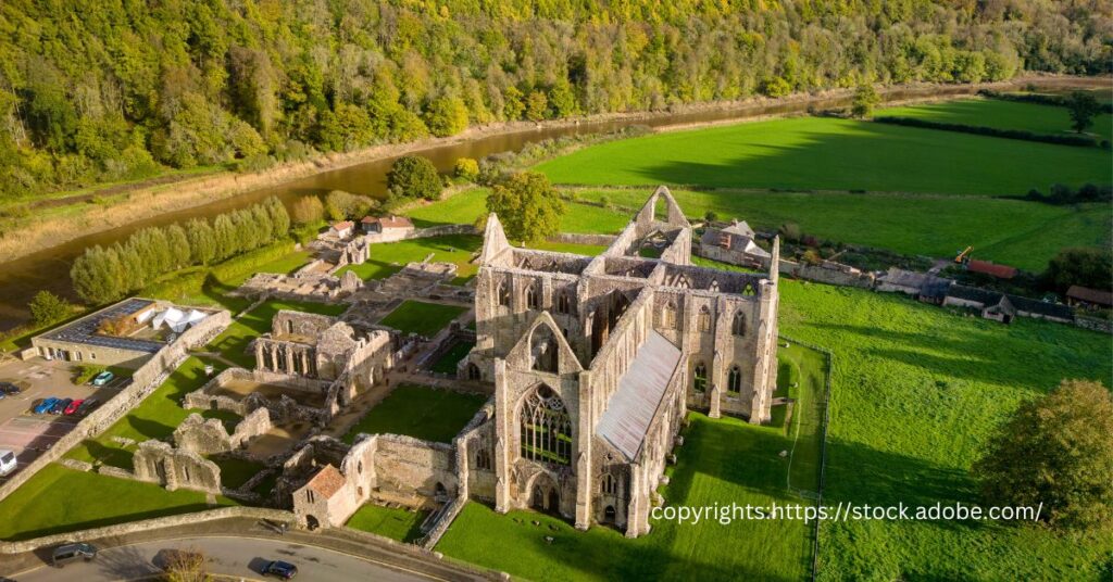 Overhead view of Tintern Abbey ruins surrounded by the vibrant greenery of Wye Valley