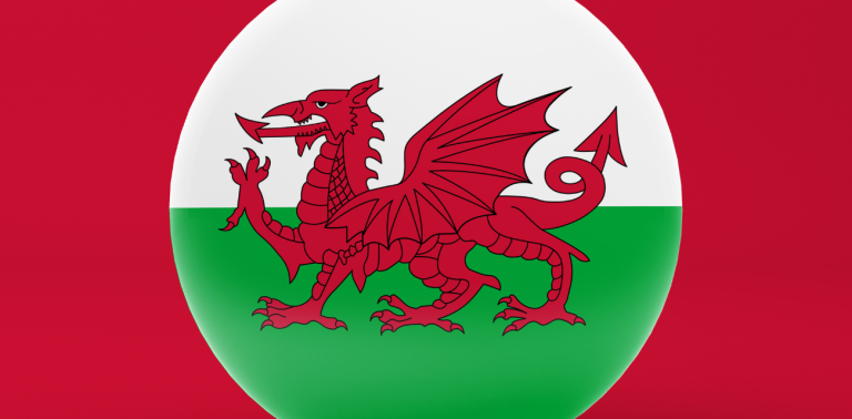 Welsh flag featuring a red dragon on a white and green background.