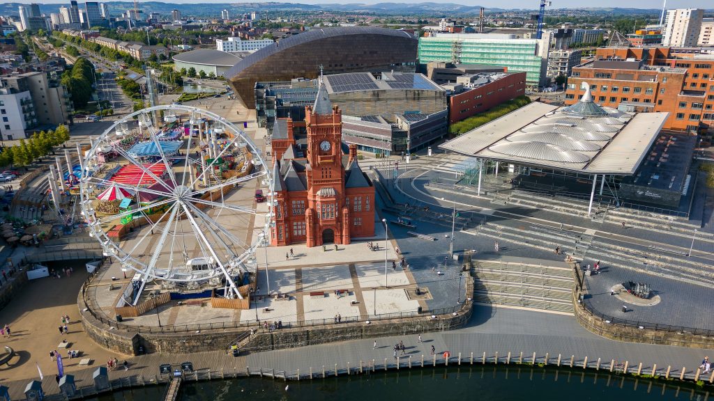 Aerial view of Cardiff Bay showing the Pierhead Building, the Senedd, and the Wales Millennium Centre.