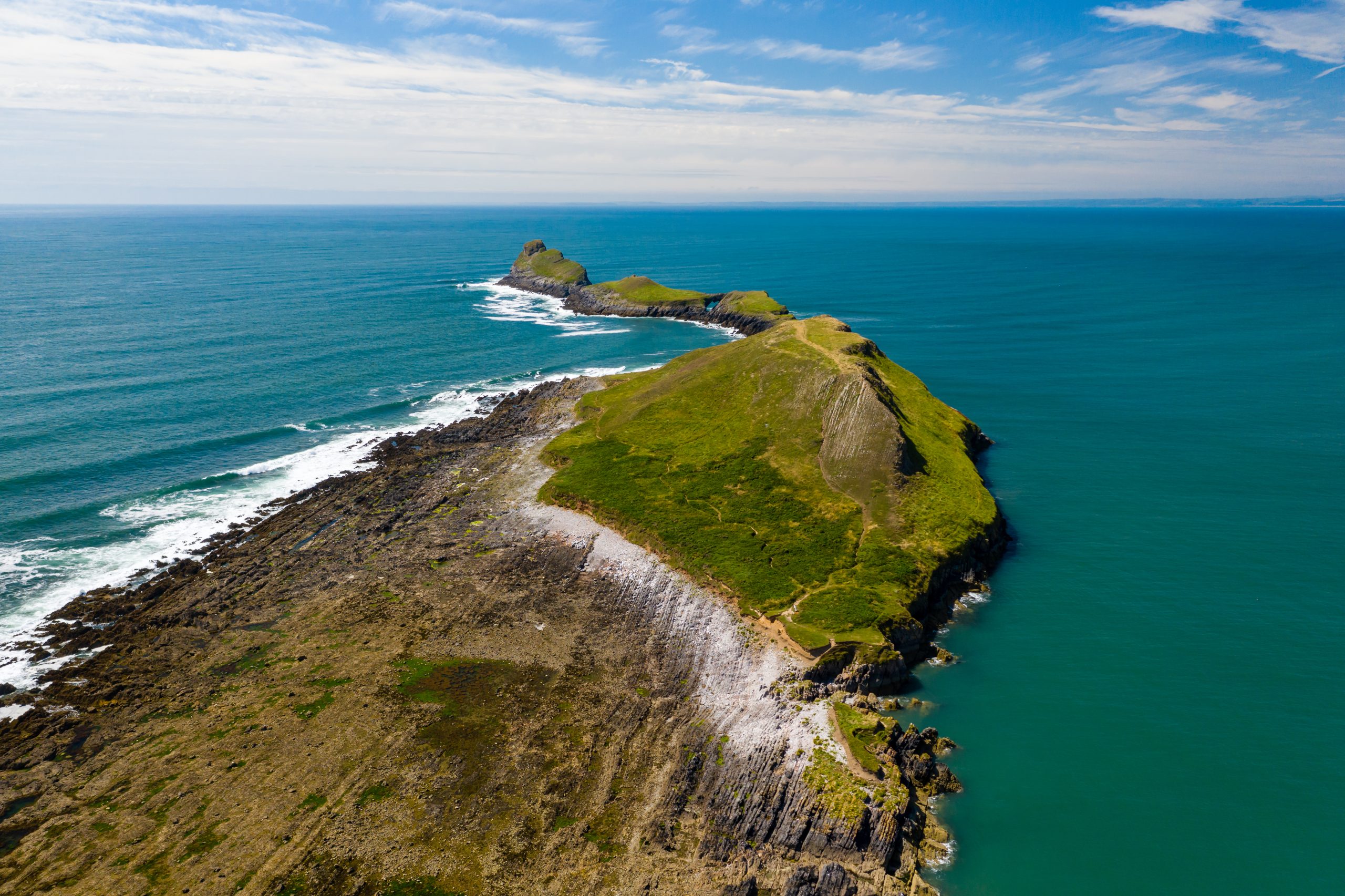 Aerial view of Worm’s Head, the iconic tidal island at Rhossili Bay in South Wales