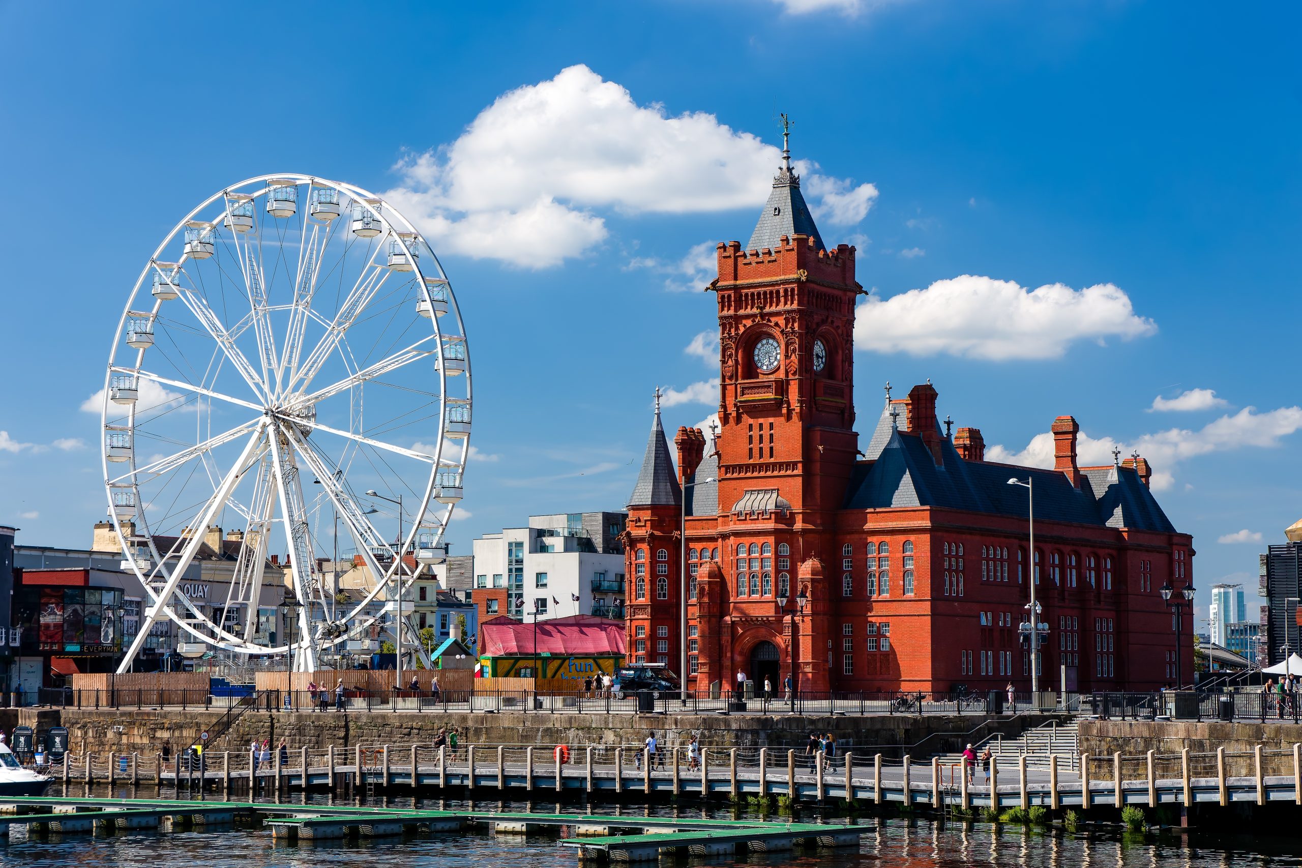 The Pierhead Building and giant wheel at Cardiff Bay on a summer day in South Wales