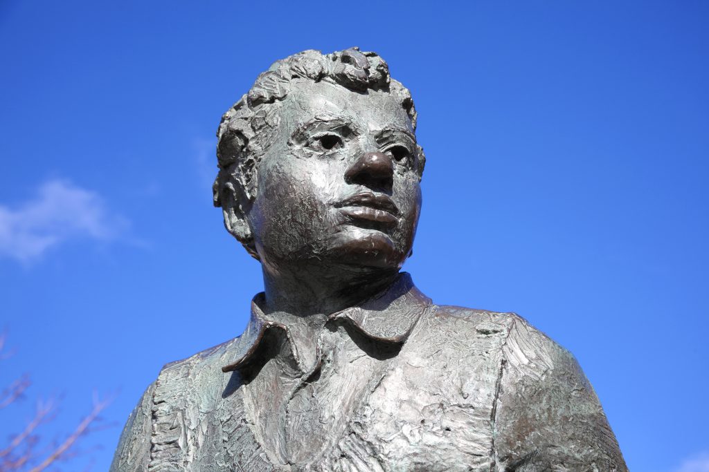 Dylan Thomas statue outside the theatre in Swansea Marina, Wales