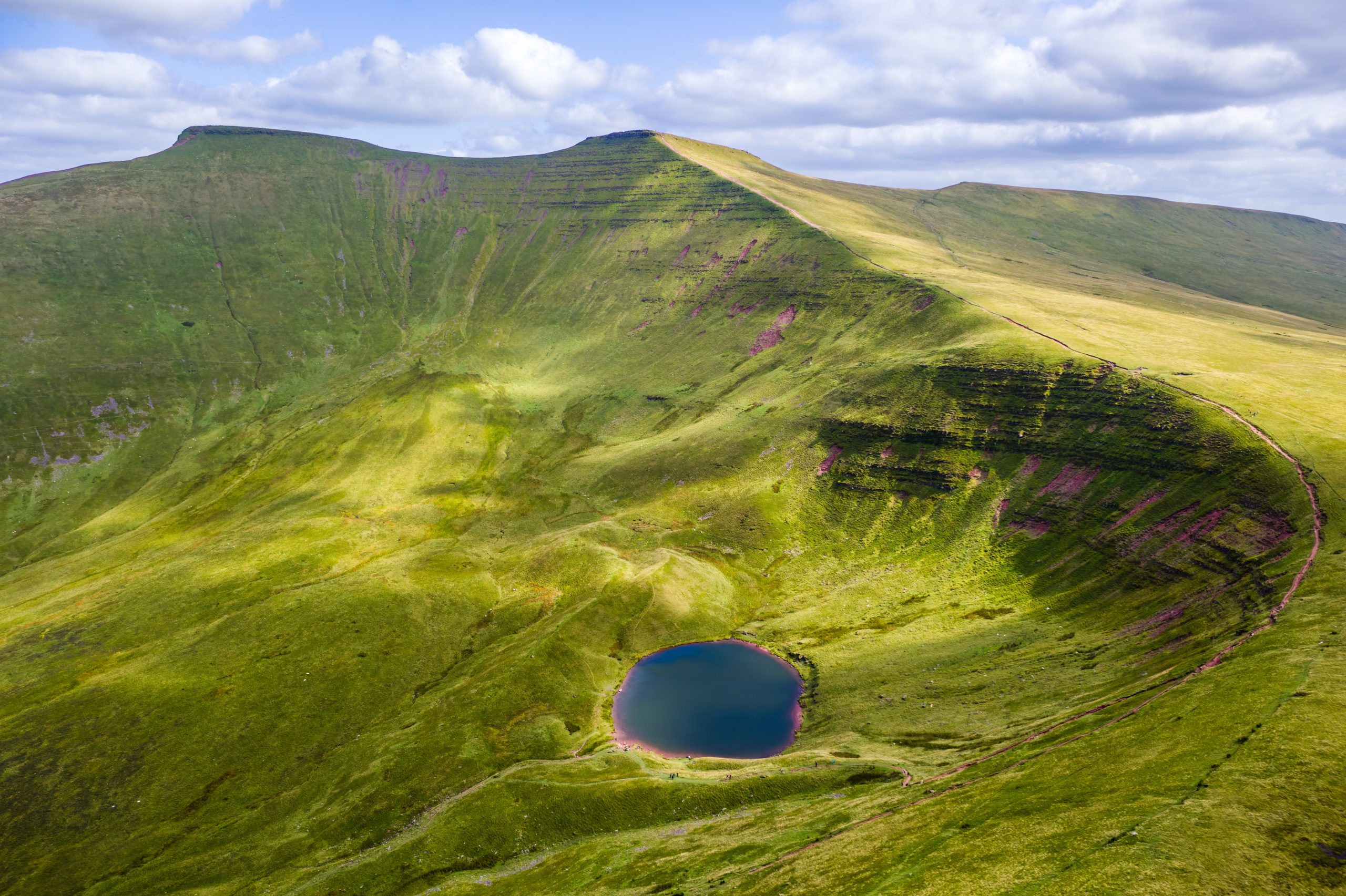 Aerial view of Pen y Fan, Corn Du, and Cwm Llwch lake in the Brecon Beacons National Park, Wales.