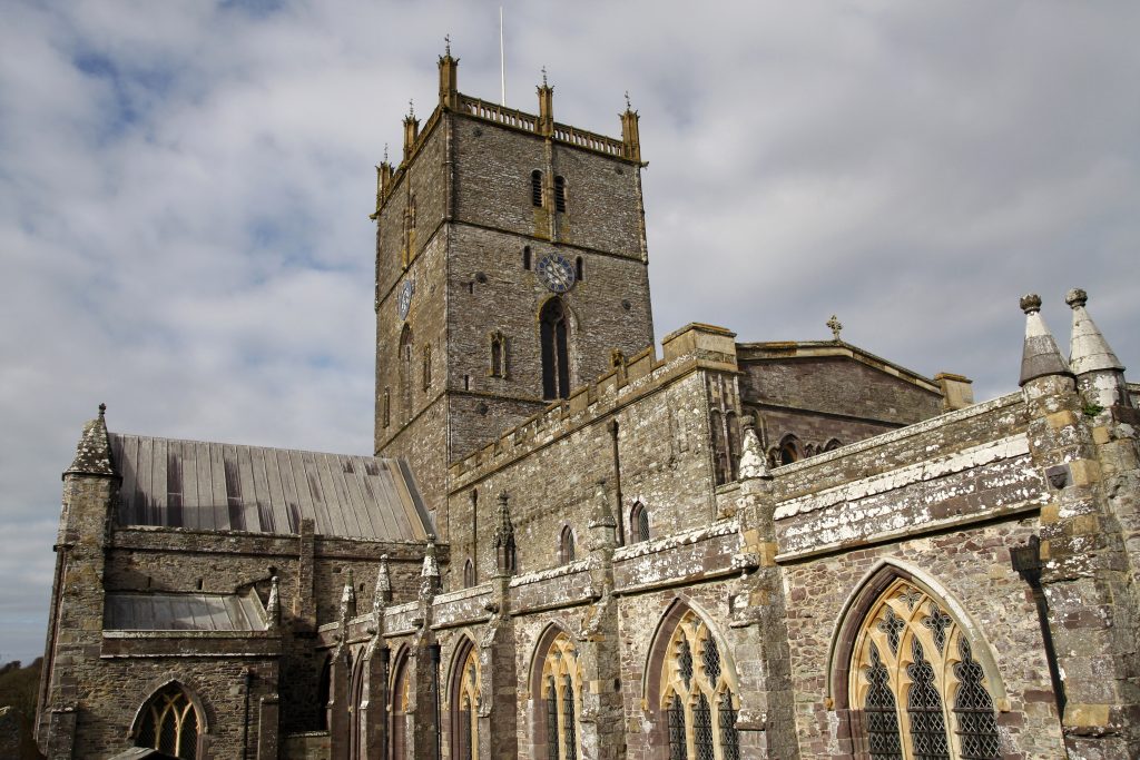 St Davids Cathedral in Pembrokeshire, Wales, with its stone architecture, central tower, and historic Gothic features.